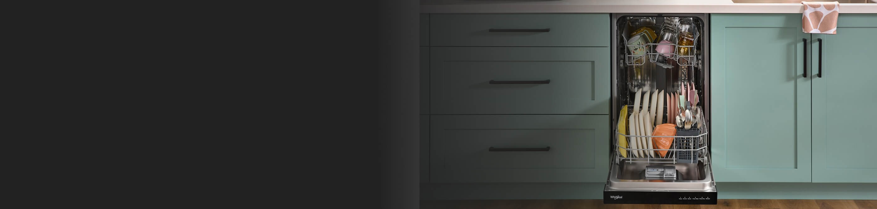 An open Whirlpool® Dishwasher in a kitchen