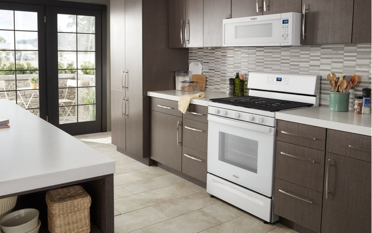 Kitchen featuring Whirlpool® range and microwave in white Kitchen featuring Whirlpool® range and microwave in white