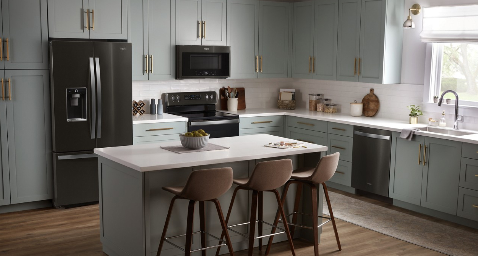 Gray kitchen featuring Whirlpool® appliances in black stainless steel