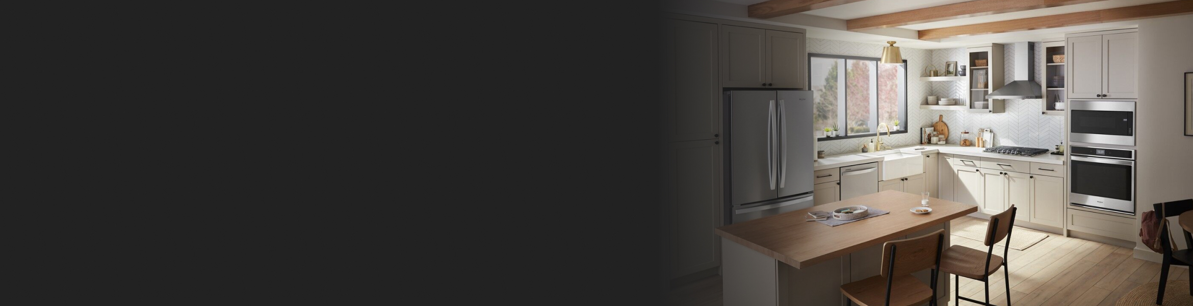 White kitchen featuring Whirlpool® stainless steel appliances