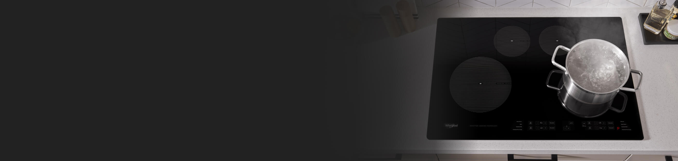 A pot of water boiling on an induction cooktop