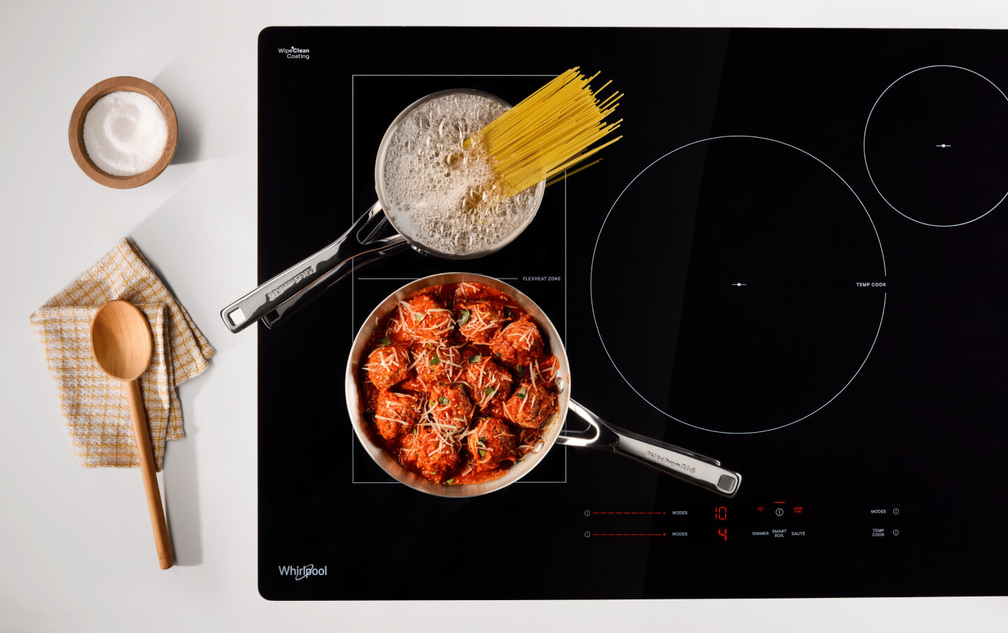 Spaghetti and meatballs cooking on a Whirlpool® Induction Cooktop