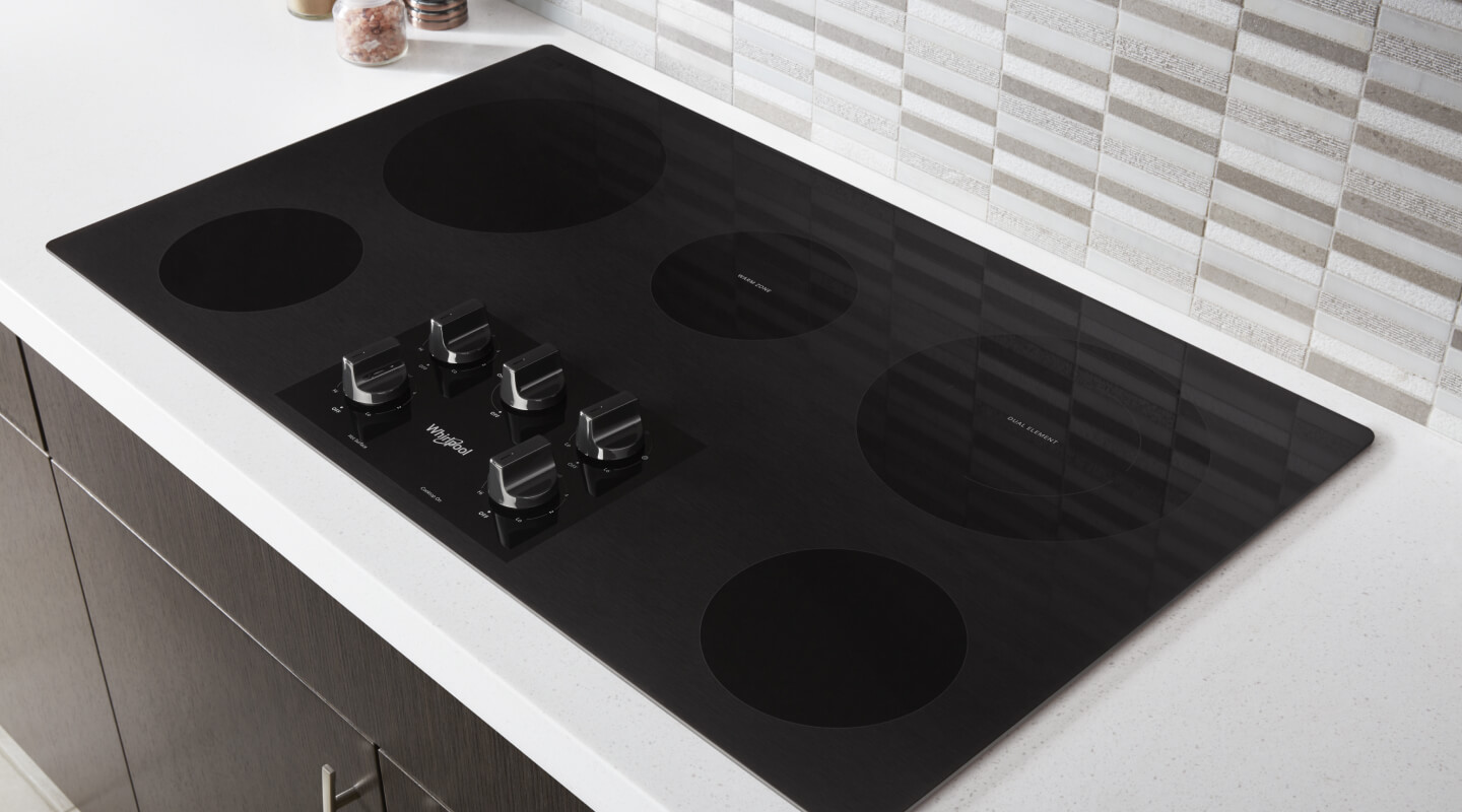 A black Whirlpool® Electric Cooktop