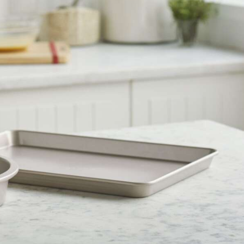 Empty baking sheet on a granite countertop