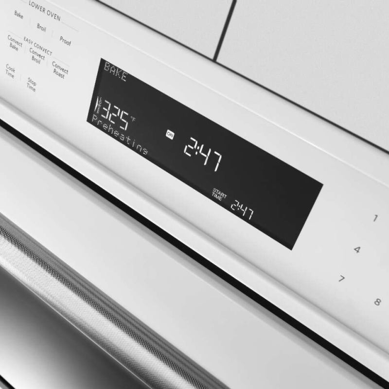 Close-up of oven control panel displaying time and oven temperature