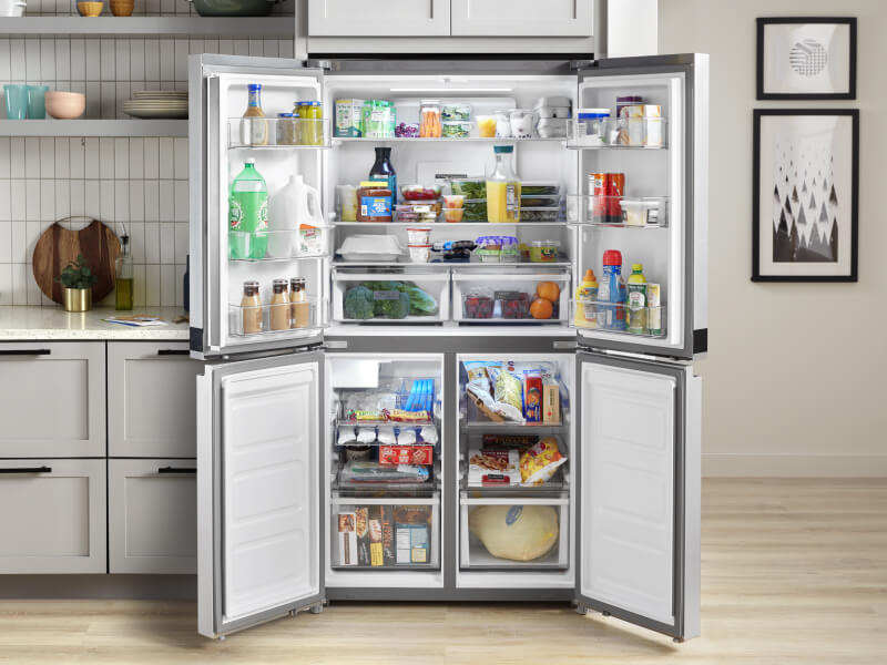 Refrigerator with doors open to show contents
