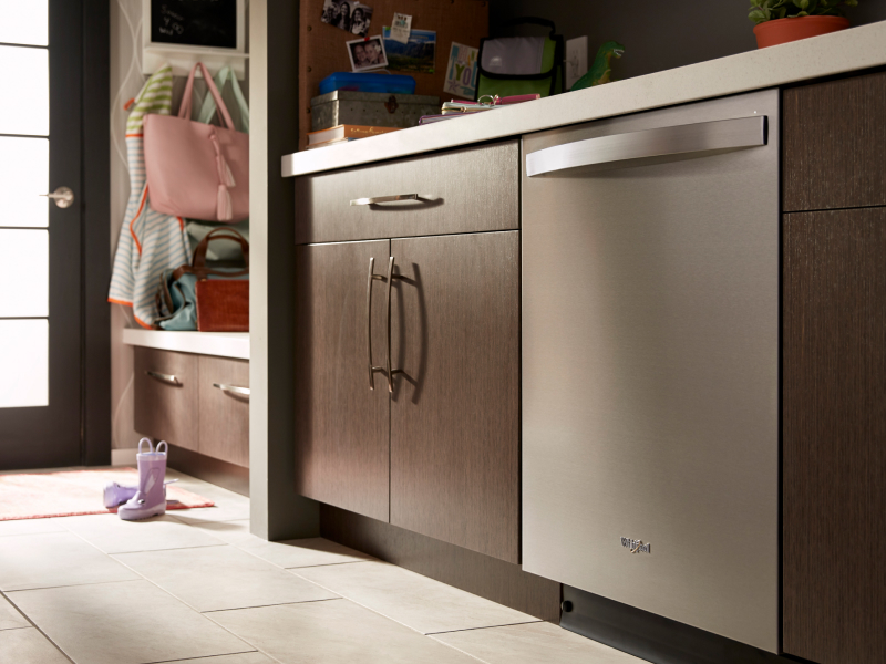 Stainless steel Whirlpool® dishwasher in a modern kitchen Stainless steel Whirlpool® dishwasher in a modern kitchen