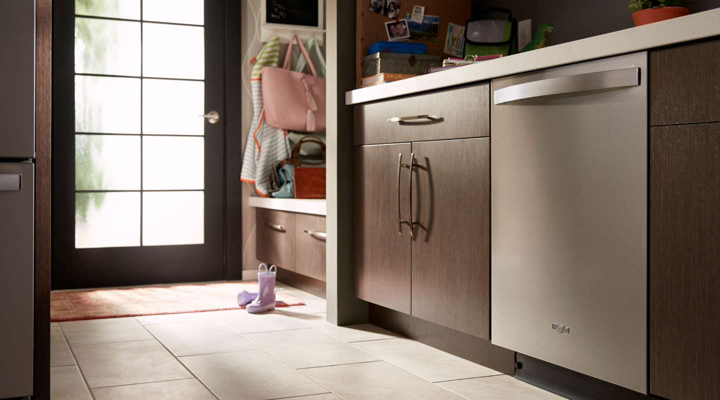 Stainless steel Whirlpool® dishwasher in a modern kitchen Stainless steel Whirlpool® dishwasher in a modern kitchen