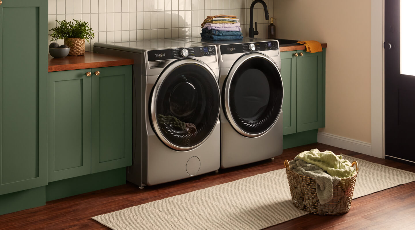 A laundry room with a front load washer and dryer pair