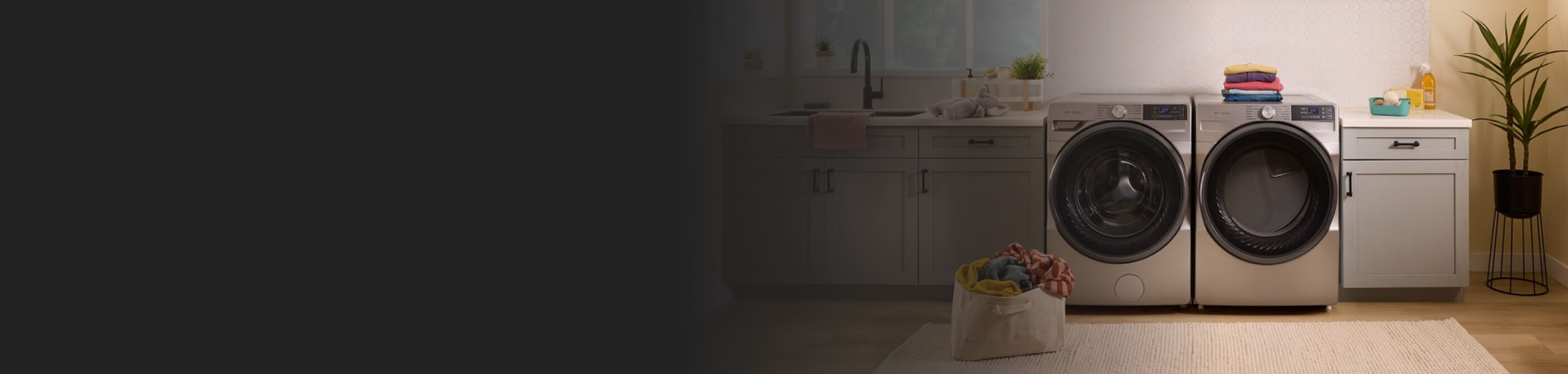 A Whirlpool® Washer and Dryer set in a modern laundry room