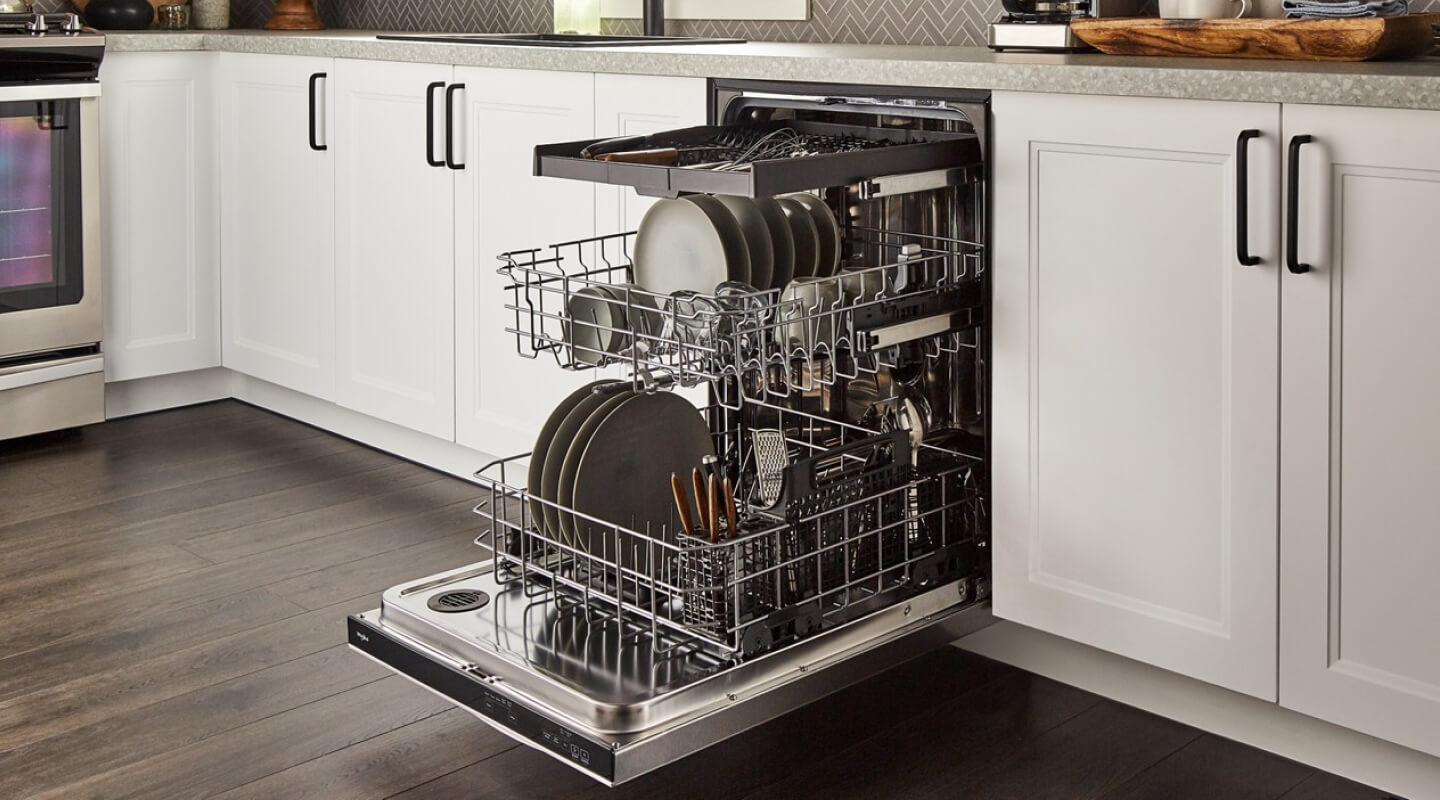 An open Whirlpool® Dishwasher in a modern kitchen