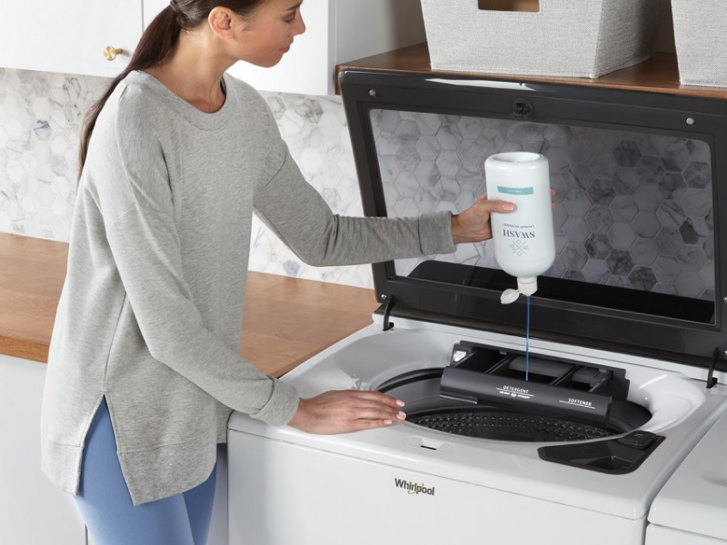 A person pouring Swash® Laundry Detergent into the dispenser of a white Whirlpool® Top Load Washer A person pouring Swash® Laundry Detergent into the dispenser of a white Whirlpool® Top Load Washer
