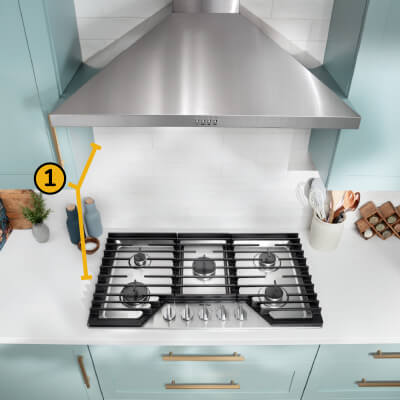 A Whirlpool® Cooktop below a Whirlpool® Range Hood with a number one