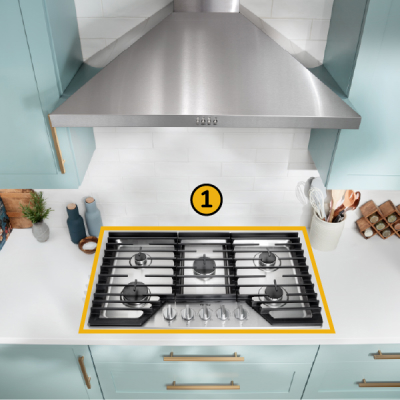 A Whirlpool® Cooktop below a Whirlpool® Range Hood with a number one