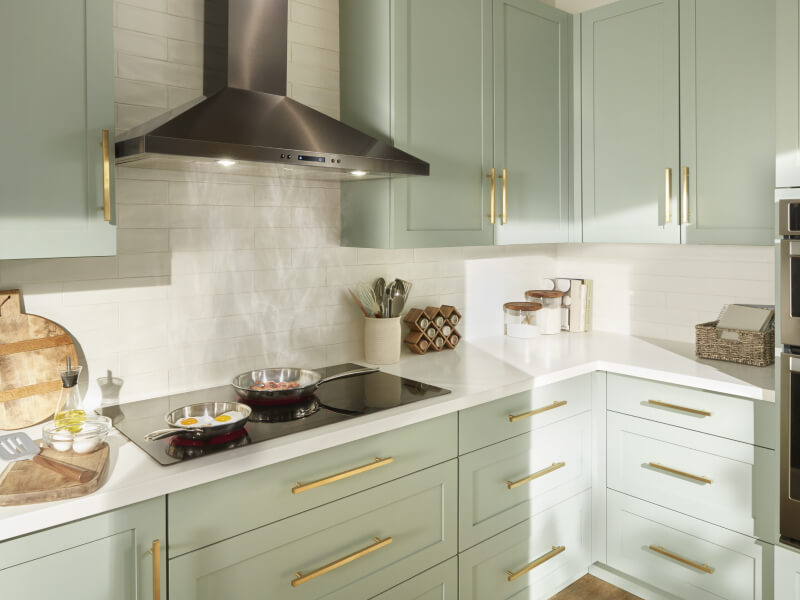 Items cooking on a Whirlpool® Cooktop