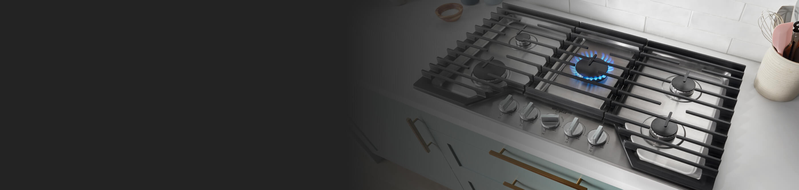 A Whirlpool® Cooktop with the burner on