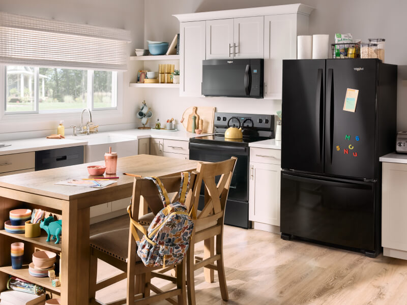 A kitchen with a suite of black Whirlpool® Appliances A kitchen with a suite of black Whirlpool® Appliances