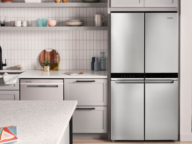 A bright kitchen with a Whirlpool® 4 Door Refrigerator in stainless steel A bright kitchen with a Whirlpool® 4 Door Refrigerator in stainless steel
