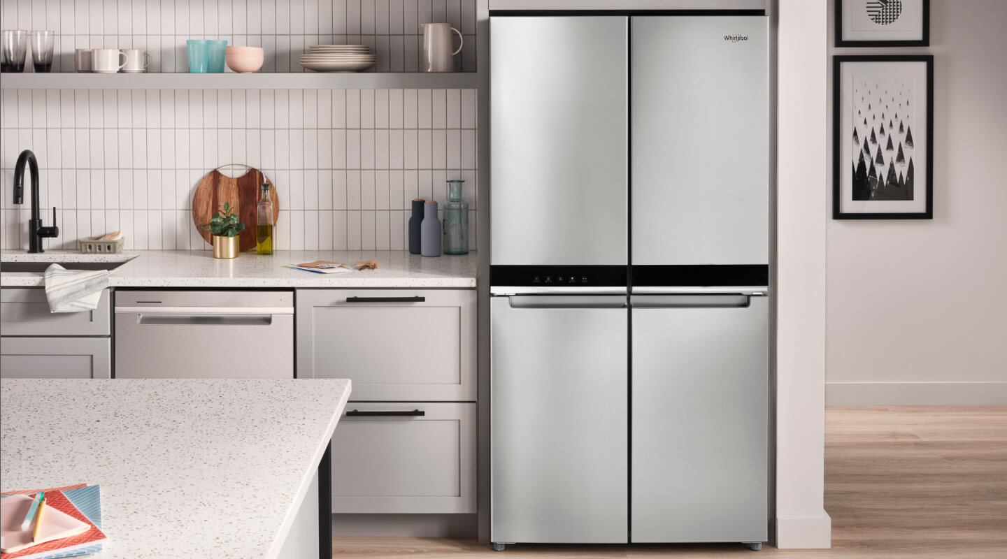 A bright kitchen with a Whirlpool® 4 Door Refrigerator in stainless steel A bright kitchen with a Whirlpool® 4 Door Refrigerator in stainless steel