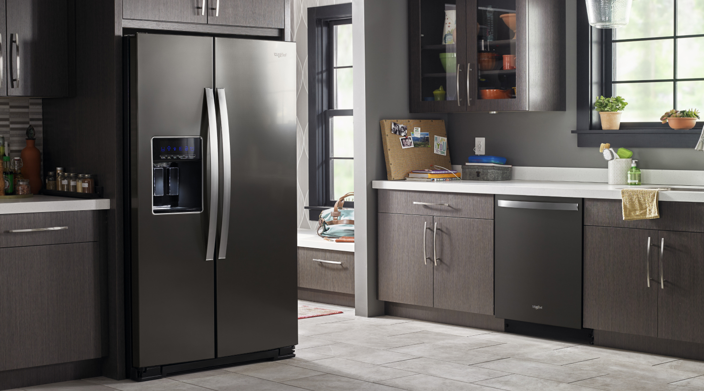 A refrigerator set in a kitchen A refrigerator set in a kitchen