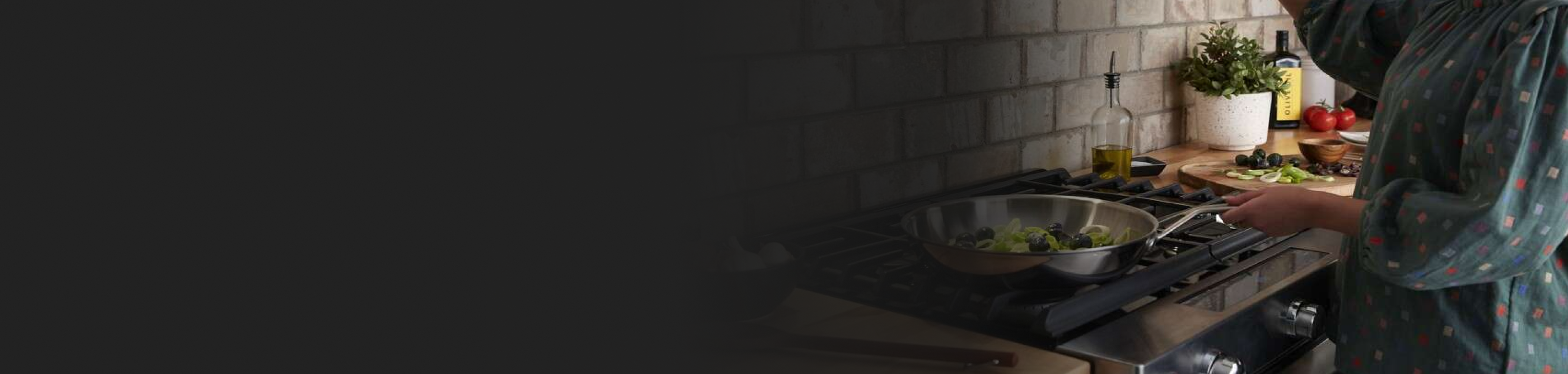 Person cooking broccoli in a pan