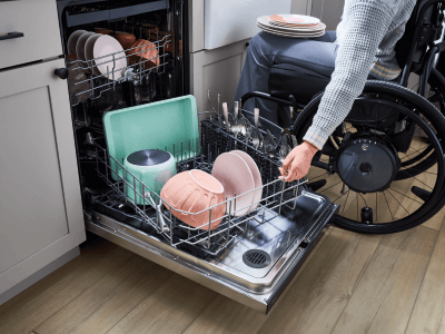 Person rotating a Whirlpool brand Spin&Load Dishwasher Rack