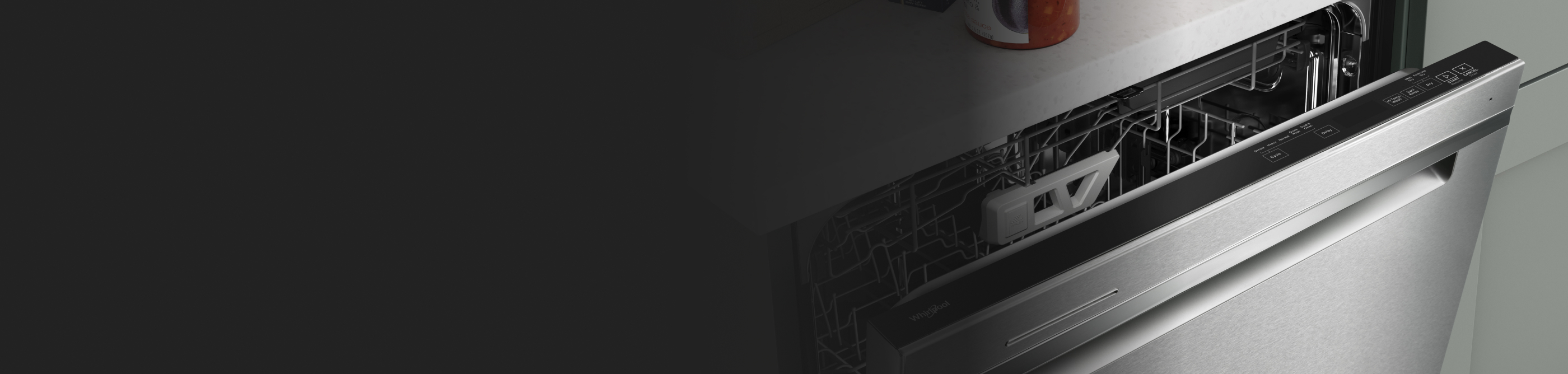 A dishwasher door slightly ajar