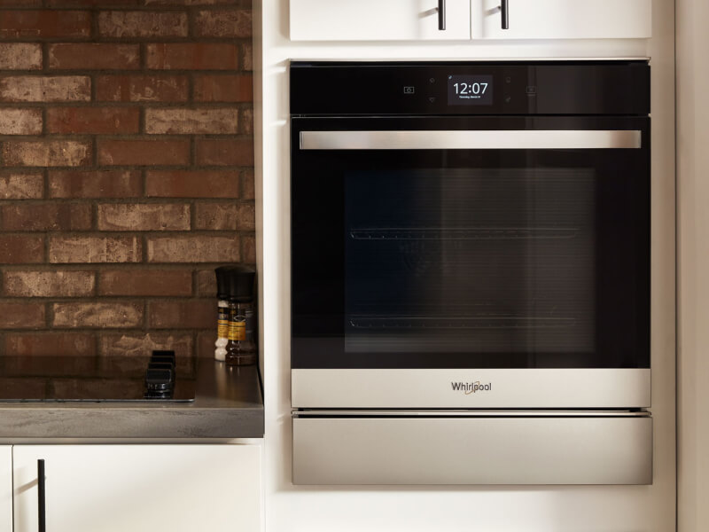 Stainless steel Whirlpool® wall oven in a rustic kitchen Stainless steel Whirlpool® wall oven in a rustic kitchen