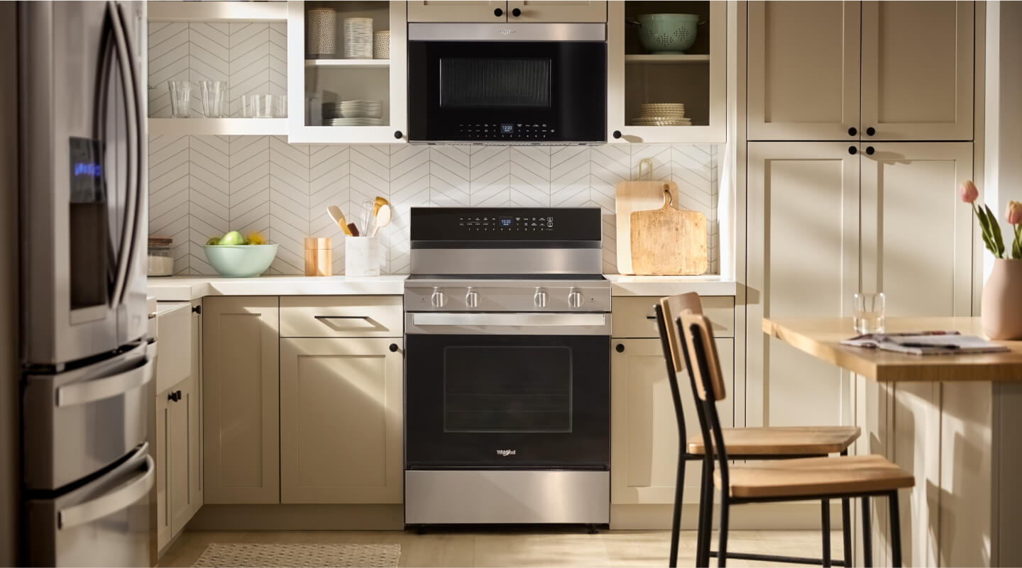 Stainless steel Whirlpool® appliances in a modern kitchen