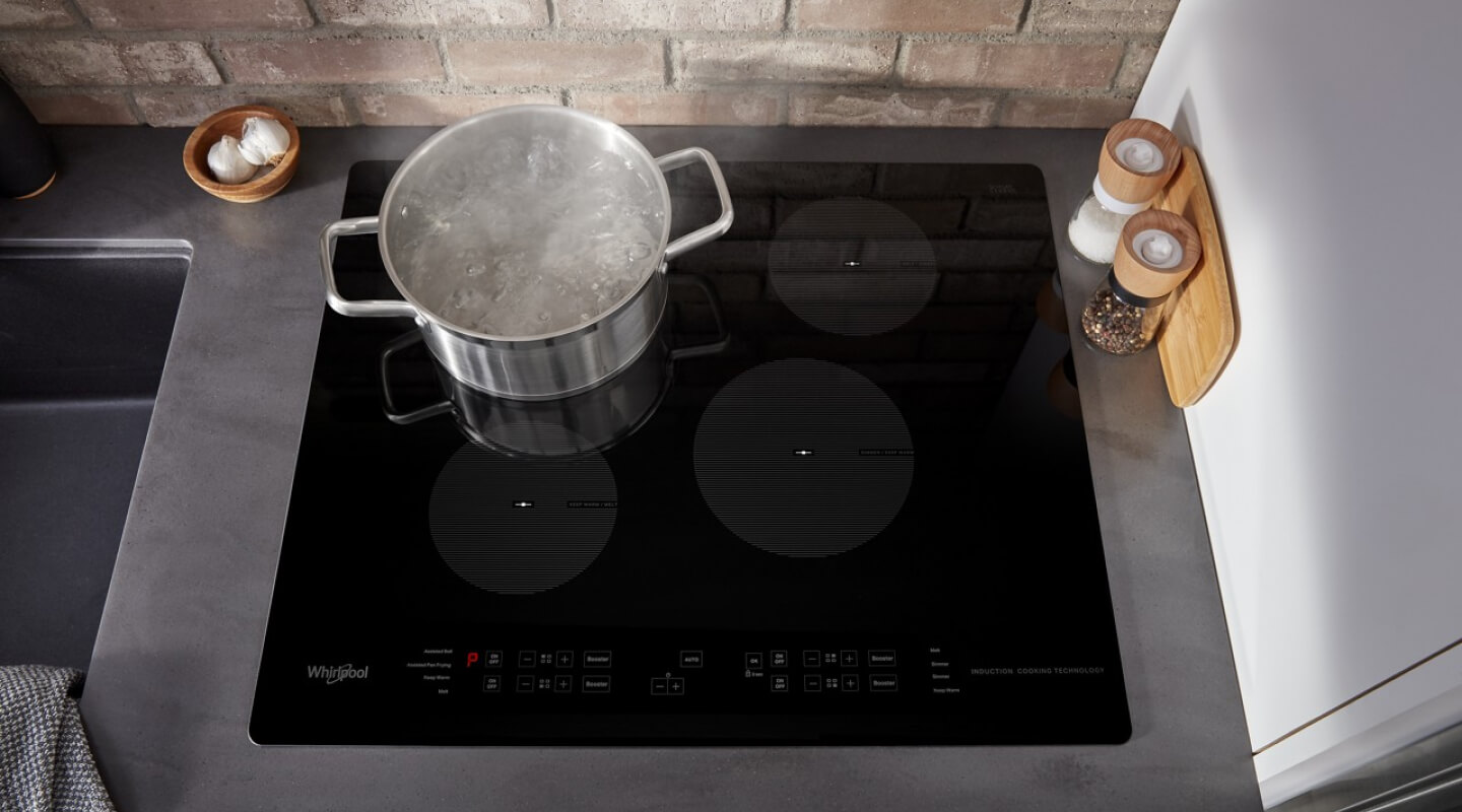 A pot boiling water on a Whirlpool® Induction Cooktop