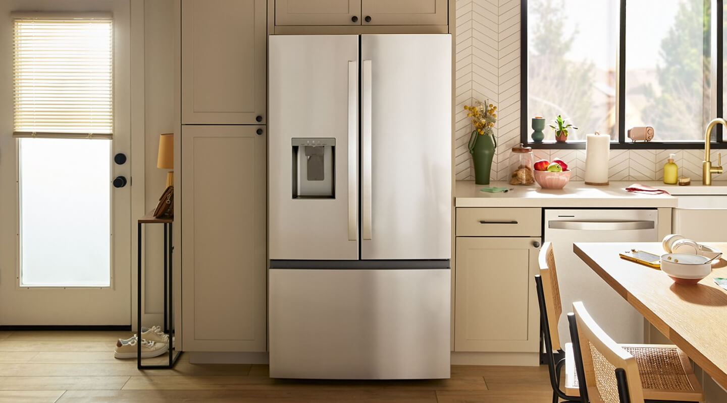 Stainless steel Whirlpool® Refrigerator set in cream cabinetry