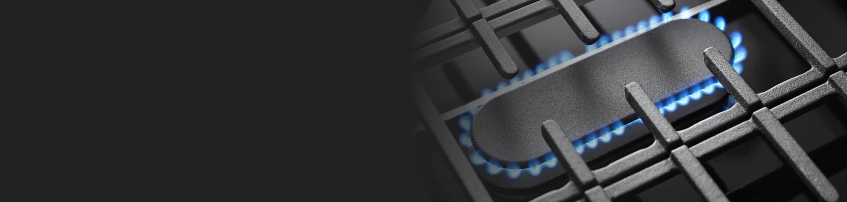 The lit middle oval burner on a Whirlpool brand gas range