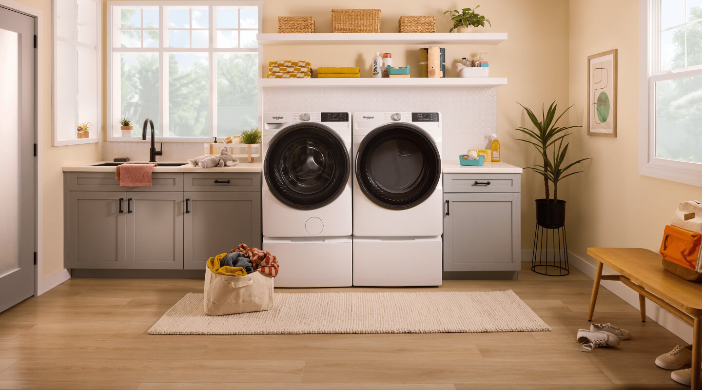 White, front-load washer and dryer from Whirlpool brand in laundry room