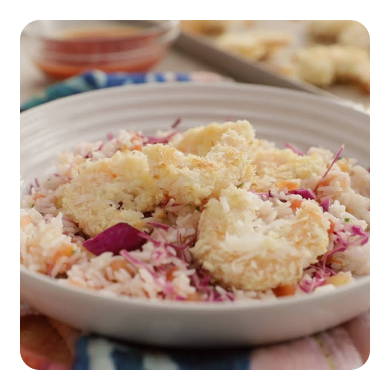 Coconut shrimp in a white dish