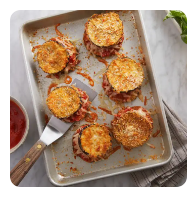 Breaded eggplant on a silver sheet pan