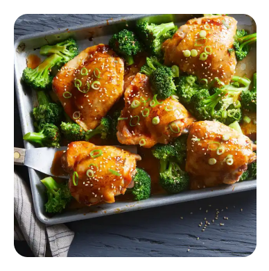 Chicken thighs and broccoli on a sheet pan