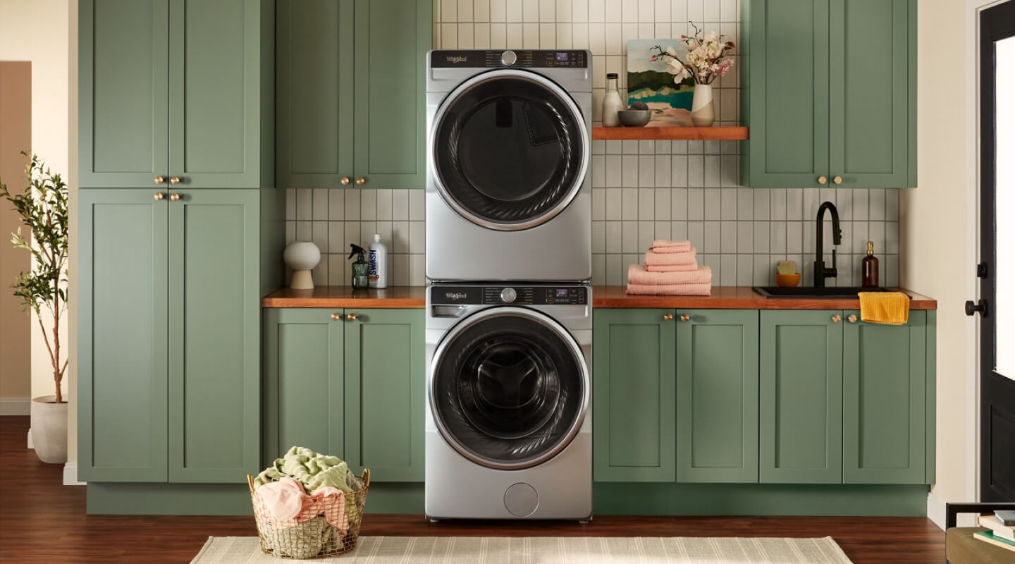 A stackable washer and dryer in a laundry room in a house