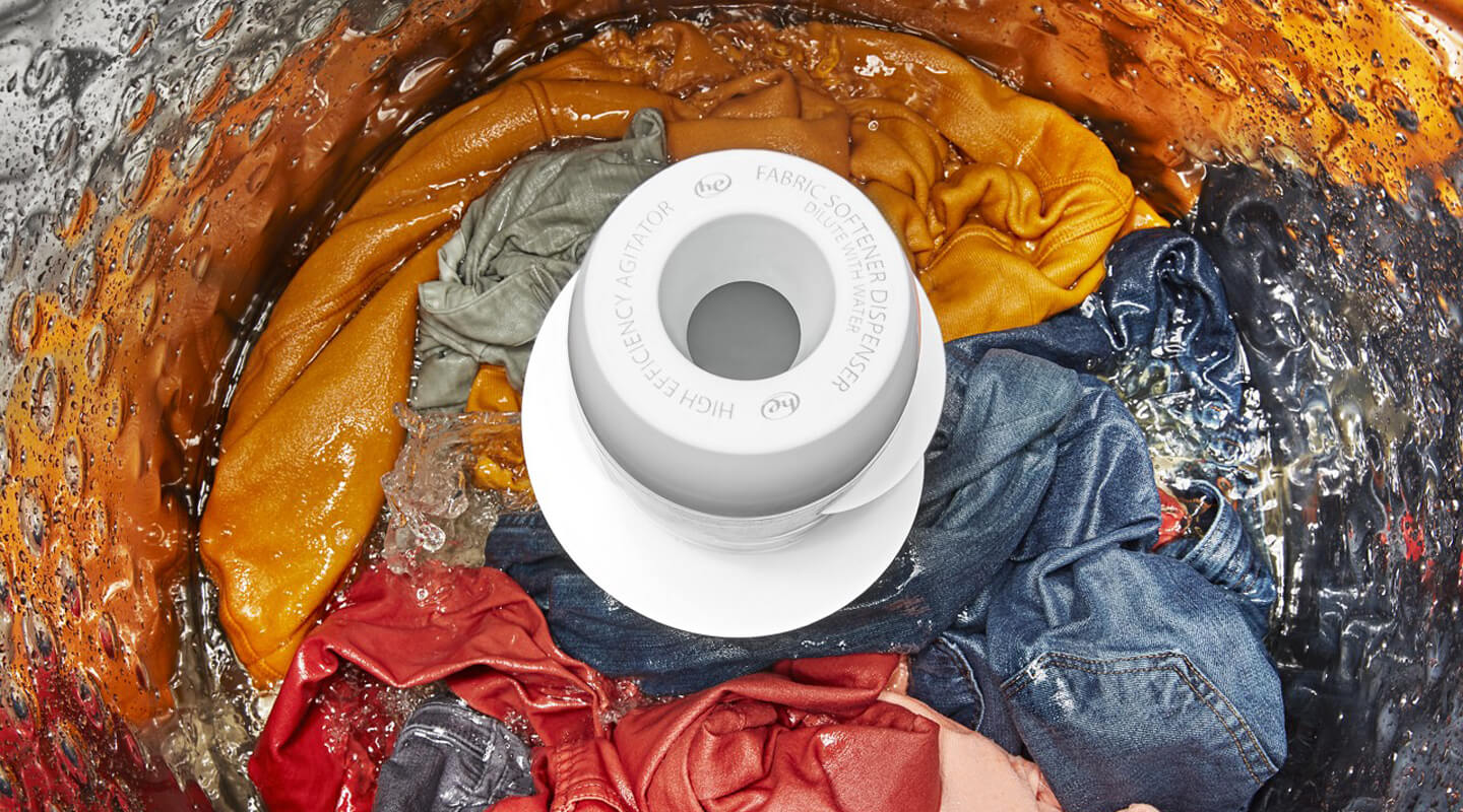 Bright clothing soaking in a washer Bright clothing soaking in a washer
