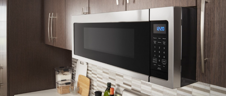 A Whirlpool® microwave installed over a range A Whirlpool® microwave installed over a range