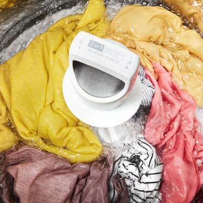 Clothes going through a rinse cycle in a washer