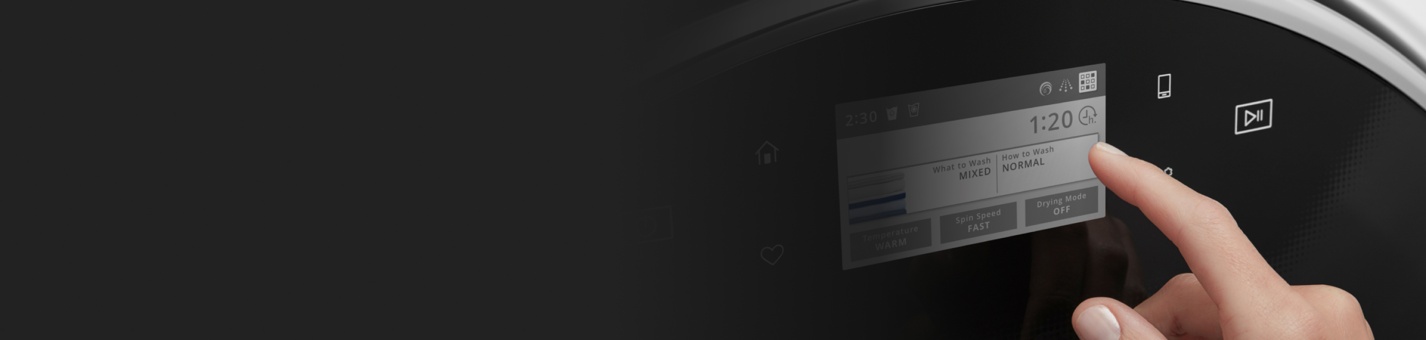 Person selecting a setting on a washing machine control panel