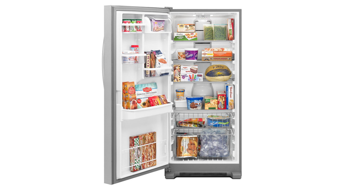 Upright freezer opened to show contents Upright freezer opened to show contents