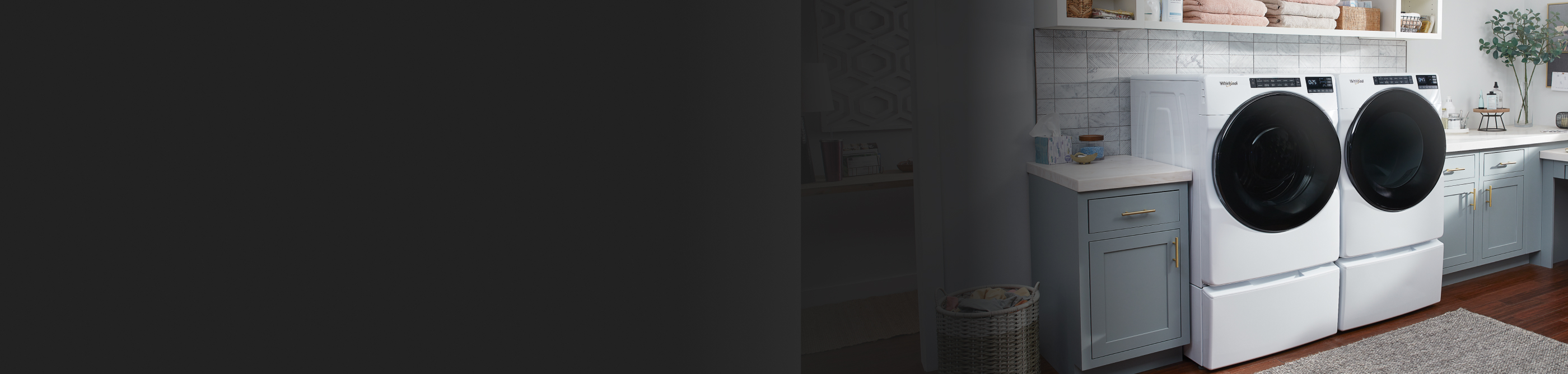 Laundry room with blue cabinets and white counters