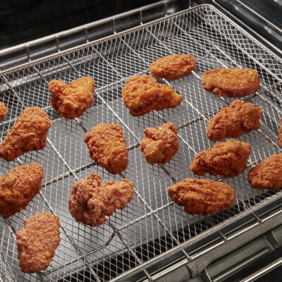 Breaded chicken on an air frying tray