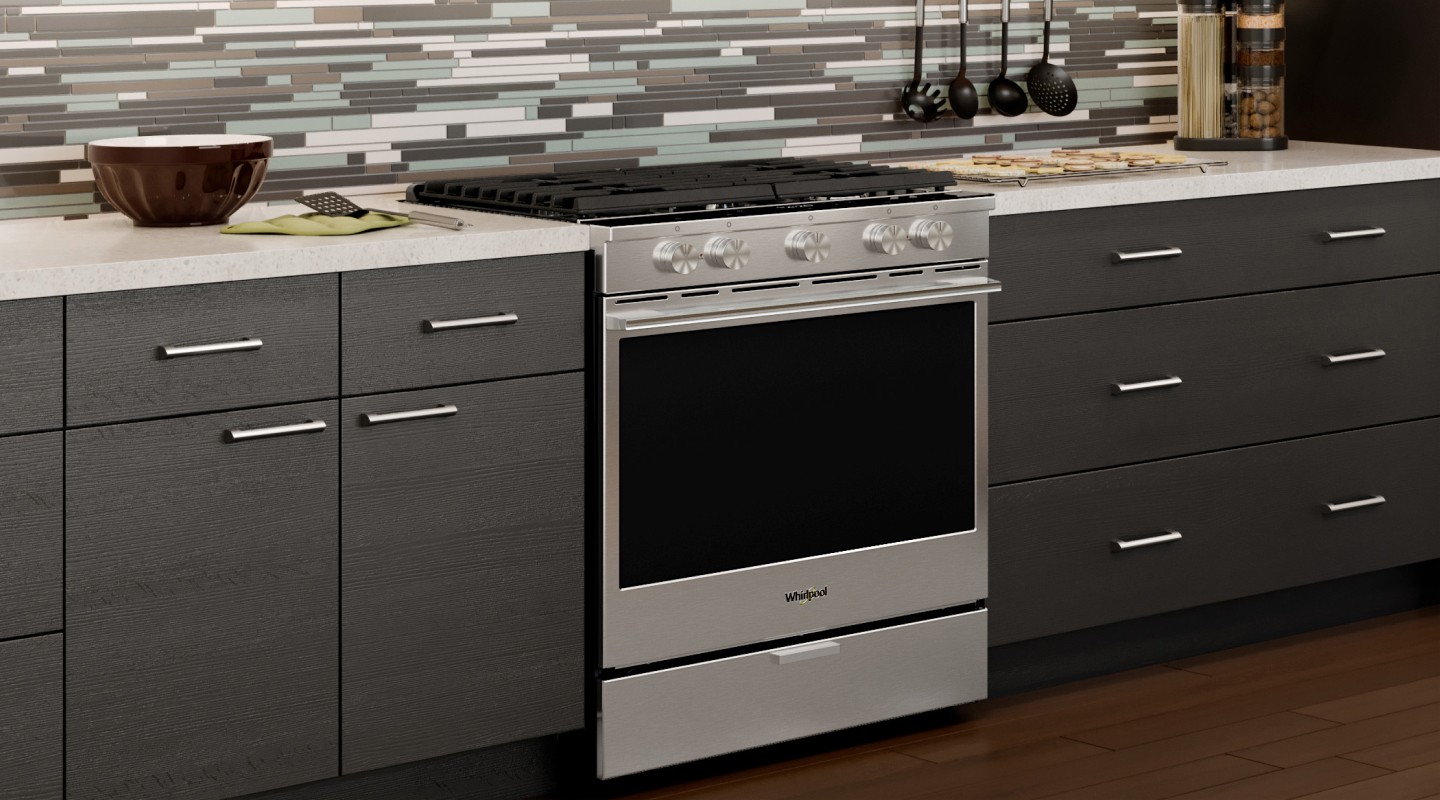 A Whirlpool® oven with Air Fry Mode in a modern kitchen. A Whirlpool® oven with Air Fry Mode in a modern kitchen.