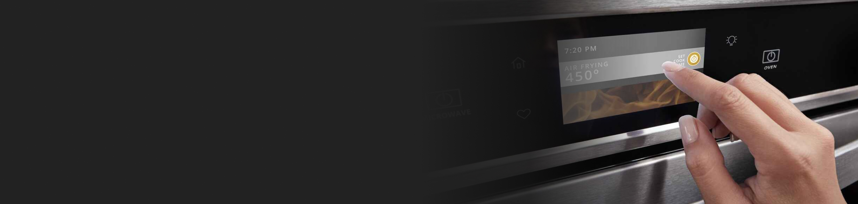 A closeup of a person programming a Whirlpool® oven with Air Fry Mode.