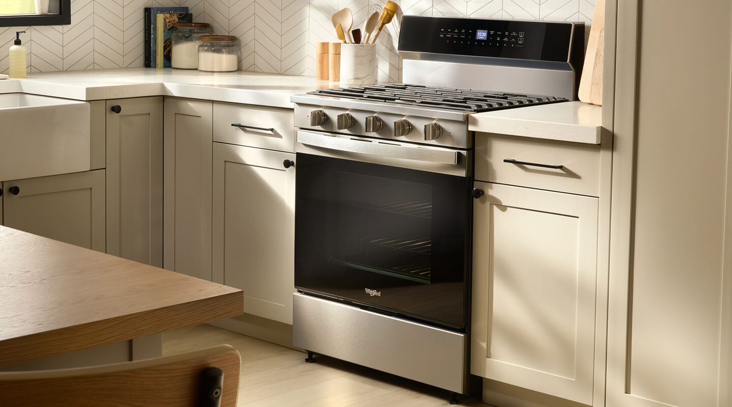 A Whirlpool® oven with Air Fry Mode in a kitchen with light beige cabinetry