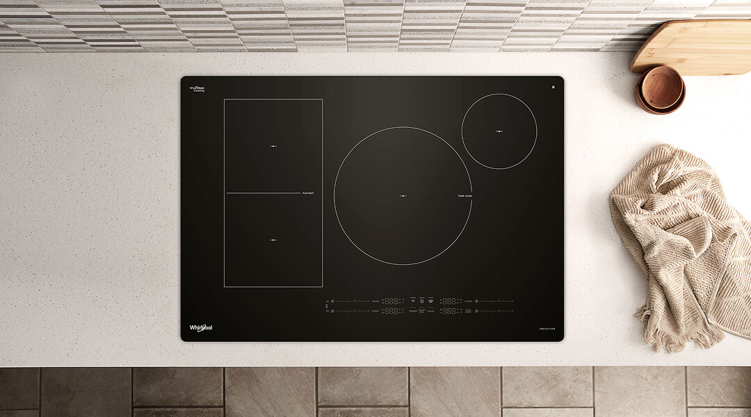 A Whirlpool® Induction Cooktop surrounded by a white countertop
