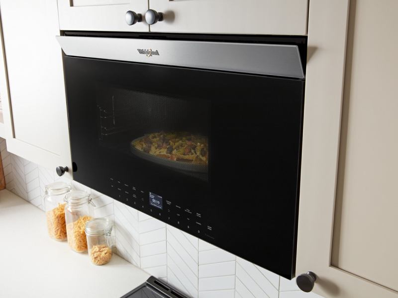 Nachos cooking inside a Whirlpool® Over-the-Range Microwave Nachos cooking inside a Whirlpool® Over-the-Range Microwave