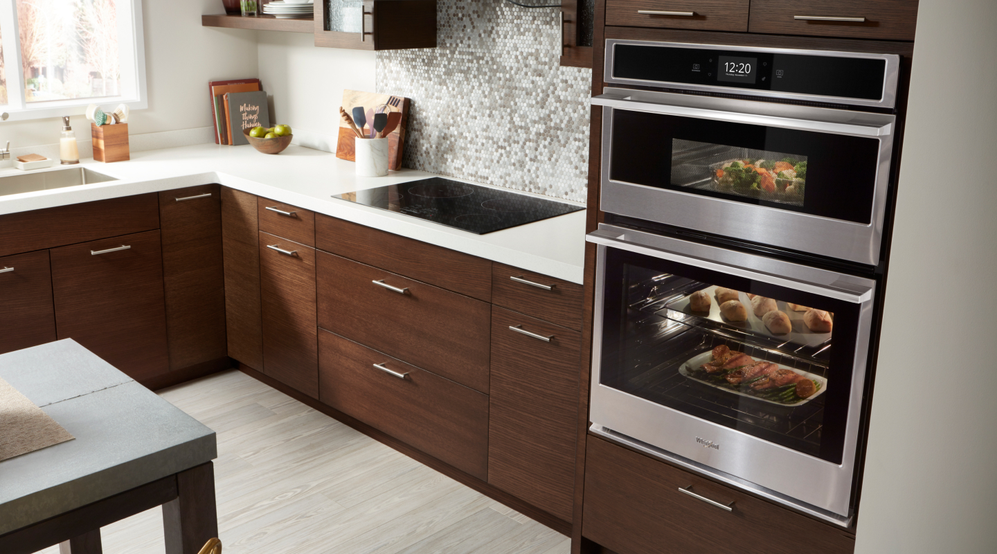 Whirlpool brand combination wall oven and microwave with food inside Whirlpool brand combination wall oven and microwave with food inside